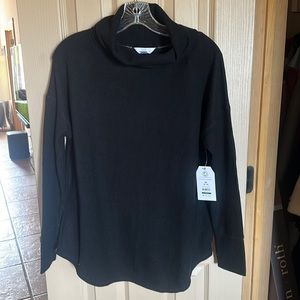 Black long sleeved, waffle weave, cowl neck sweater.